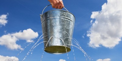 Man Holding Leaking Bucket